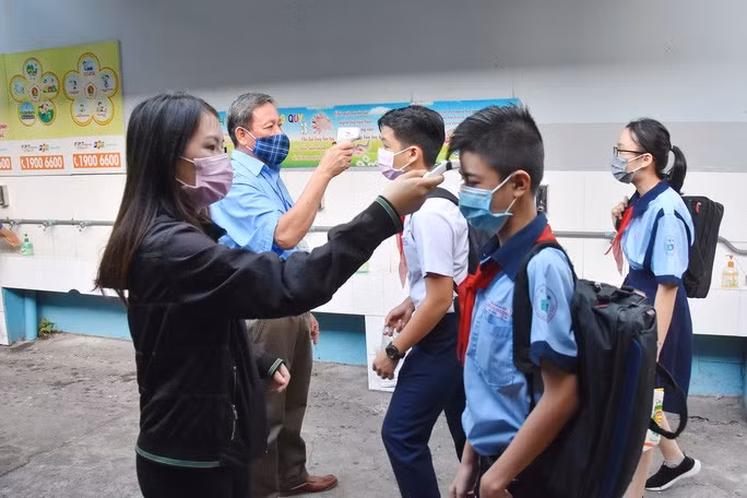  Việt Nam về cơ bản đã kiểm soát được dịch Covid-19, học sinh an tâm trở lại trường. Ảnh: TẤN THẠNH