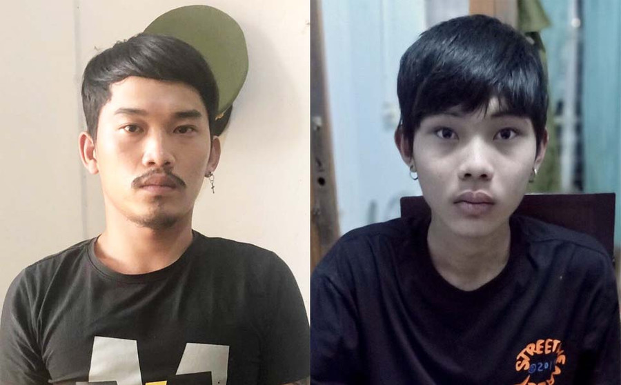 Đối tượng Nguyễn Khánh Trung (bìa trái) và Hồ Thanh Luật tại cơ quan công an. Ảnh: Thúy Trinh