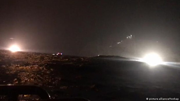  Hoạt động tìm kiếm, cứu hộ vụ rơi trực thăng. (Nguồn: dw.com)