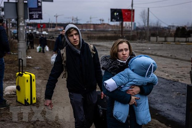 Người dân sơ tán khỏi thành phố Irpin, phía Tây Bắc Kiev, Ukraine ngày 7/3. Ảnh: AFP/TTXVN Người dân sơ tán khỏi thành phố Irpin, phía Tây Bắc Kiev, Ukraine ngày 7/3. Ảnh: AFP/TTXVN