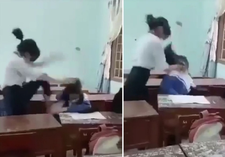  Nữ sinh L. bị nữ sinh lớp 8 đánh trong lớp học. Ảnh cắt từ clip.