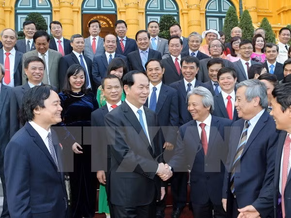 Chủ tịch nước Trần Đại Quang với các đại biểu tại buổi gặp mặt. (Ảnh: Nhan Sáng/TTXVN)