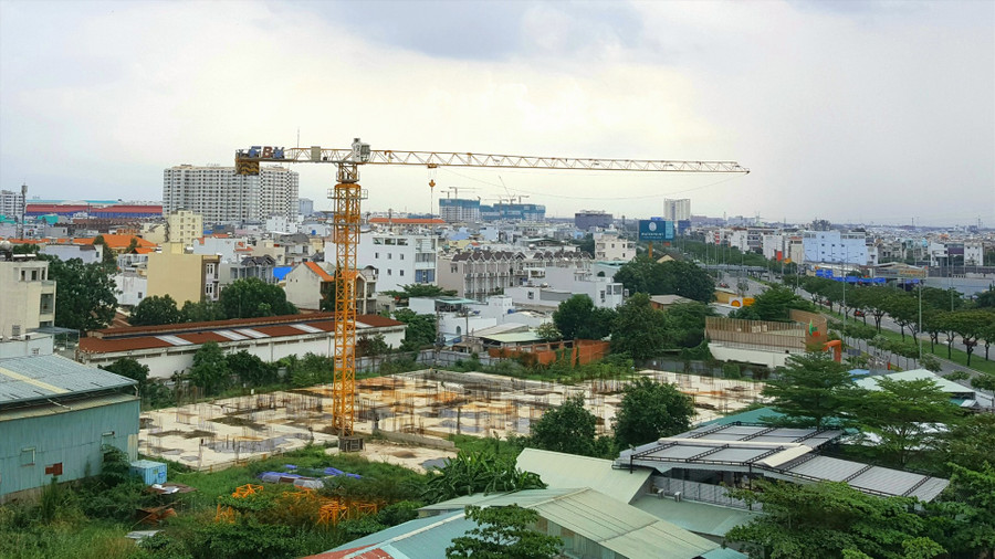 Luật Xây dựng (sửa đổi) đã rút ngắn thủ tục cấp Giấy phép xây dựng giúp các đơn vị tiết kiệm thời gian và chi phí trong khâu thẩm định thiết kế. Ảnh: Hữu Huy