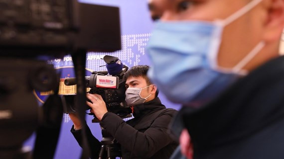 Phóng viên tác nghiệp. (Ảnh minh họa: TTXVN)