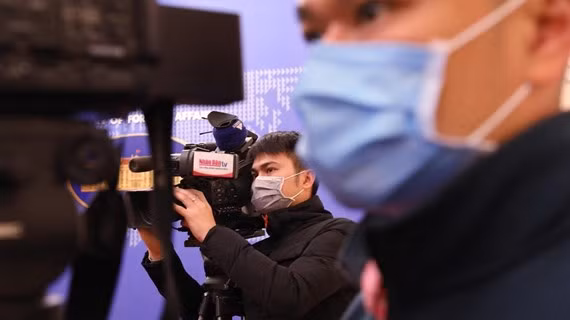 Phóng viên tác nghiệp. (Ảnh minh họa: TTXVN)