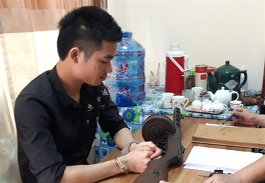 Cao Văn Hưng tại cơ quan công an - Ảnh: Nghĩa Đàn