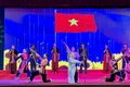 Tốp ca, múa Lá cờ Tháng Tám. Ảnh: Minh Tuấn