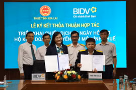 Thuế tỉnh Gia Lai hợp tác với BIDV triển khai chiến dịch 60 ngày hỗ trợ hộ kinh doanh chuyển đổi mô hình thuế. Ảnh" T.SỸ