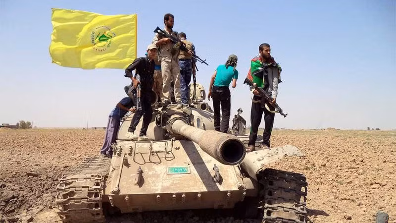 Một nhóm vũ trang của Hezbollah ở Iraq. Ảnh: AAP Một nhóm vũ trang của Hezbollah ở Iraq. Ảnh: AAP