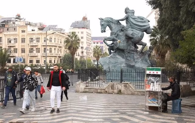 Người dân Syria tại thủ đô Damascus ngày 11.12