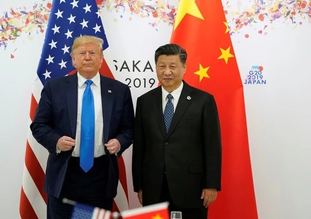Tổng thống Mỹ Donald Trump ( bìa trái) và Chủ tịch nước Trung Quốc Tập Cận Bình. Ảnh: REUTERS 1.jpg