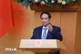 Thủ tướng Phạm Minh Chính chủ trì họp đánh giá kết quả vận hành mô hình chính quyền địa phương hai cấp. (Ảnh: Dương Giang/TTXVN)