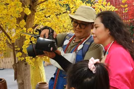 Thợ chụp ảnh kiếm cả triệu đồng mỗi ngày nhờ dịp tết