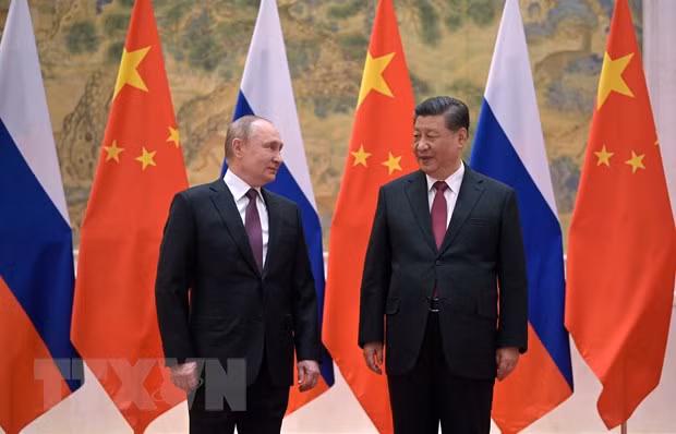 Chủ tịch Trung Quốc Tập Cận Bình (phải) trong cuộc gặp Tổng thống Nga Vladimir Putin tại Bắc Kinh, ngày 4/2/2022. Ảnh: AFP/TTXVN