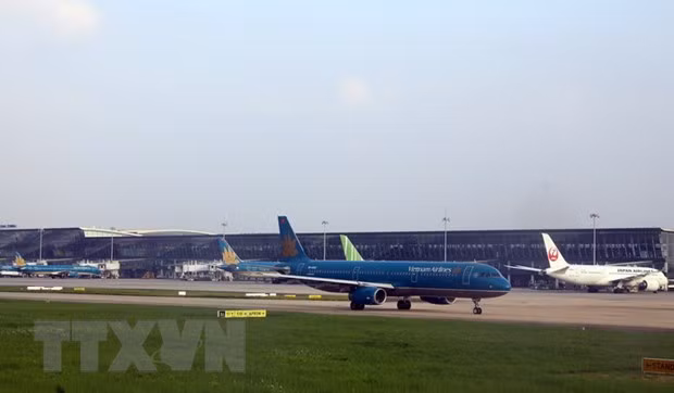  Máy bay của Vietnam Airline đỗ tại sân bay Nội Bài. (Ảnh: Huy Hùng/TTXVN)