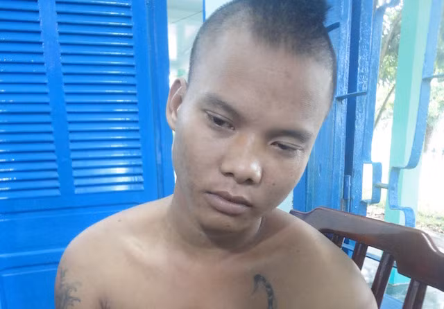 Bình tại cơ quan công an sau khi gây ra vụ phóng hoả. Ảnh: C.A.