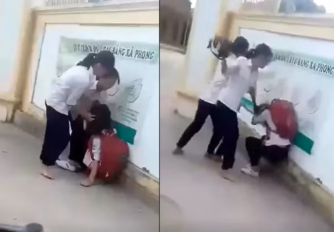 Hình ảnh em A. bị nhóm bạn đánh hội đồng trước cổng trường - Ảnh cắt từ clip