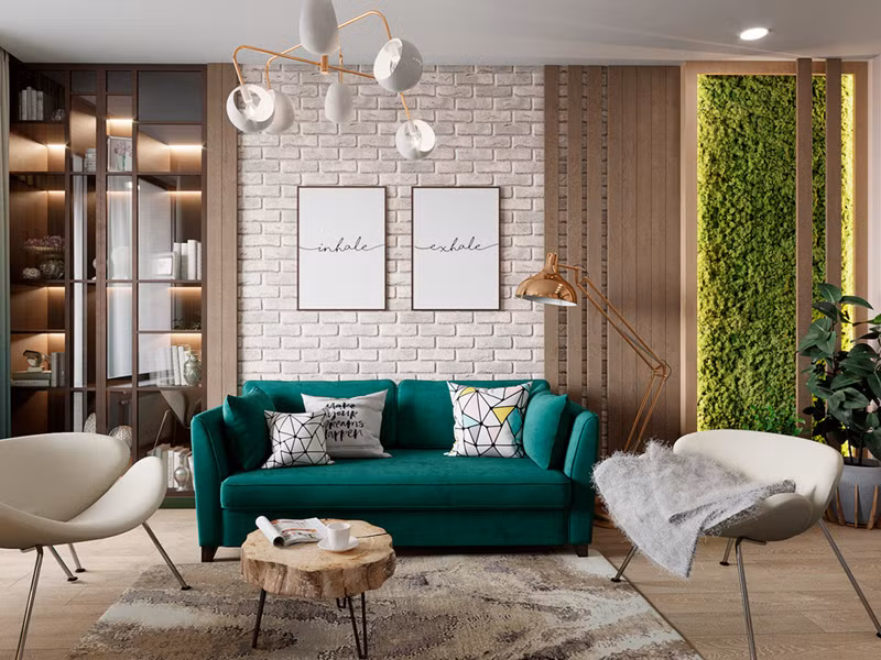  Ghế sofa màu xanh ngọc tiếp nối màu sắc của bức tường cây phía sau.
