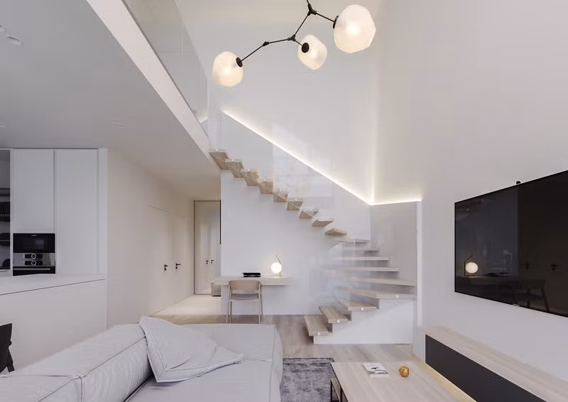  Tay vịn cầu thang làm bằng kính dẫn lên khu gác lửng. Đèn led được bố trí ở cạnh tường làm nổi bật khu vực cầu thang.