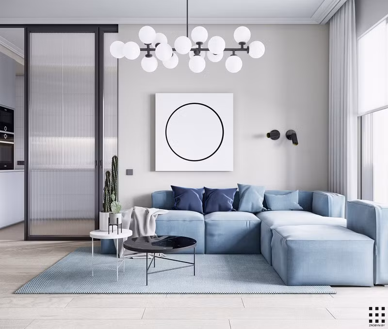 Bước vào phòng khách bạn sẽ ngạc nhiên trước vẻ đẹp nhẹ nhàng của ghế sofa màu xanh pastel. Ghế ôm trọn một tấm thảm màu xanh, bàn nước cùng đèn chùm độc đáo bên trên.