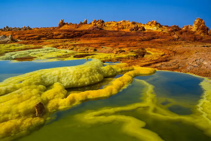  Cảnh tượng đầy màu sắc ở thị trấn hoang Dallol thuộc vùng Trũng Danakil, một trong những nơi nóng nhất thế giới. Ảnh: Corbis.