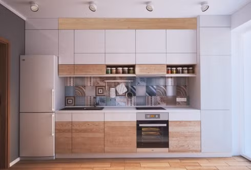 Chiếc tủ lạnh cũng được gắn với tủ bếp, ốp sát vào tường nhà. Với cách bố trí này, gia chủ sẽ tiết kiệm diện tích cho căn phòng mà vẫn có được không gian nhà bếp hiện đại. 