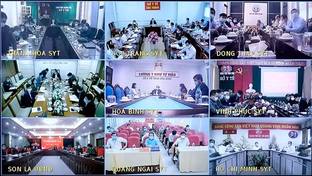  Buổi họp trực tuyến với các tỉnh thành để bàn về công tác phòng chống dịch. (Ảnh: PV/Vietnam+)