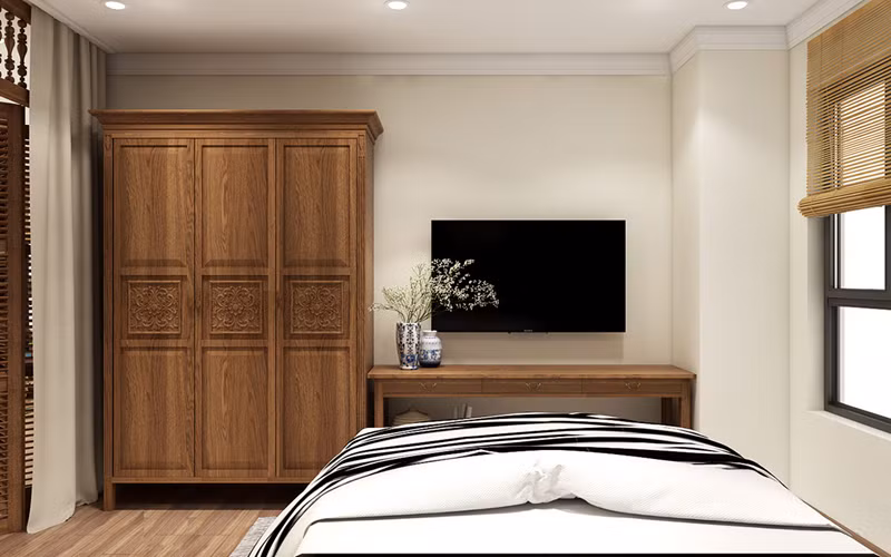 Tủ quần áo đặt ở cuối giường dễ dàng cho việc sử dụng hàng ngày.