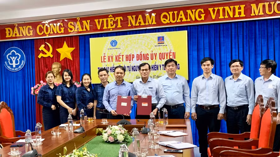 BHXH Gia Lai và Cty bảo hiểm BVI Gia Lai ký kết hợp đồng ủy quyền thu BHXH tự nguyện, BHYT tự đóng, ảnh Như Nguyện